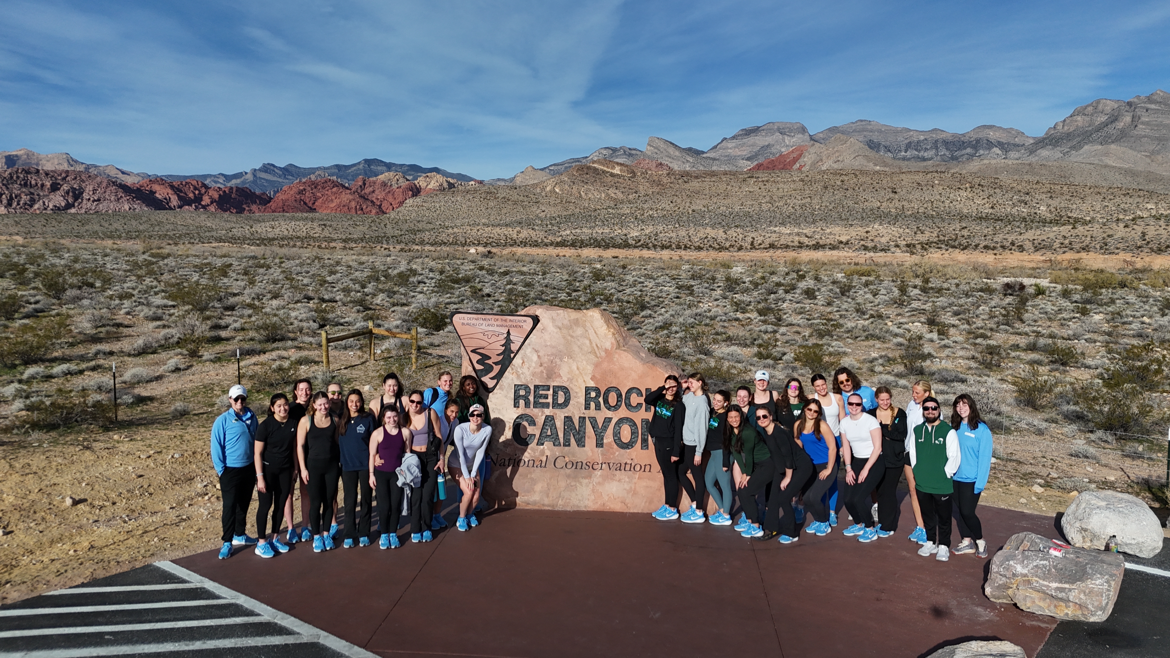 Group at Red Rock Canyon sign